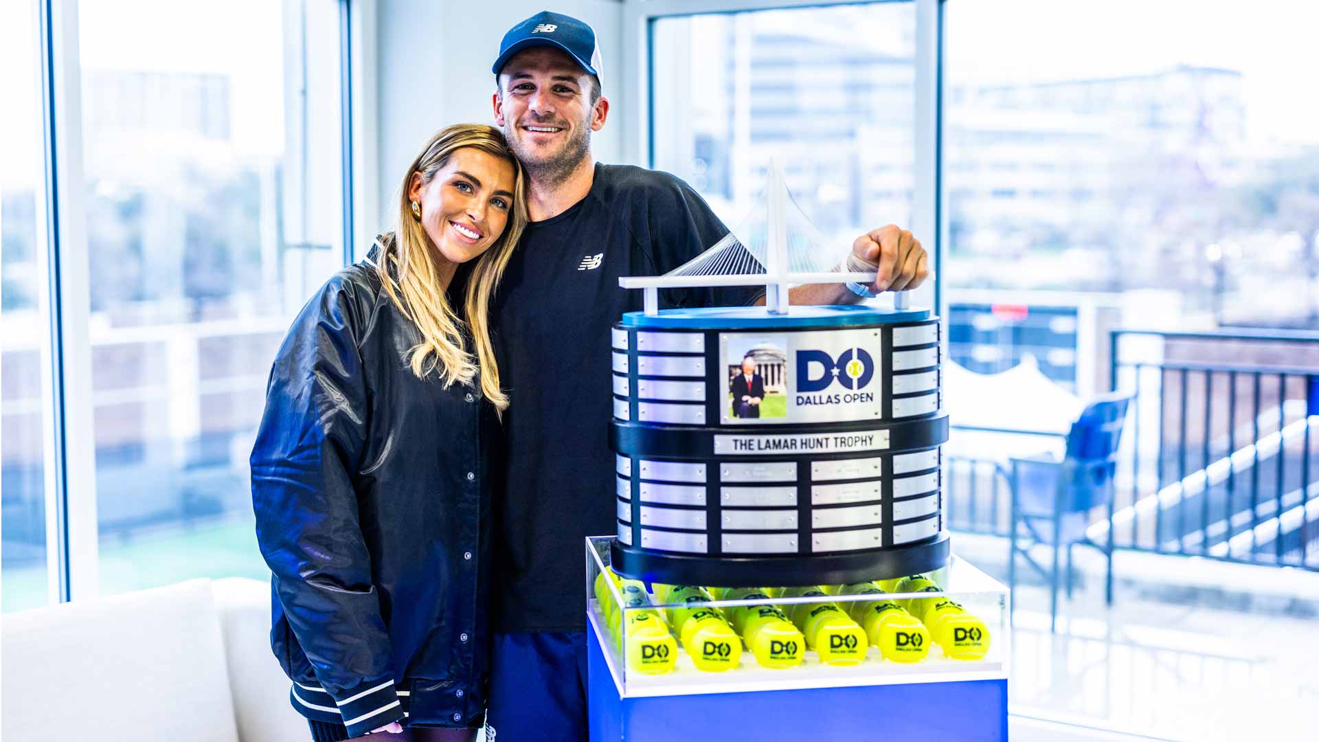 Tommy Paul celebrates his Dallas Open victory with girlfriend Paige Lorenze.